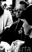 1983, Gdańsk, Polska. 
Chrzest Marii Wiktorii Wałęsy, córki Lecha Wałęsy. Na pierwszym planie Danuta Wałęsa i ksiądz Henryk Jankowski. 
Fot. Anna Pietuszko, zbiory Ośrodka KARTA