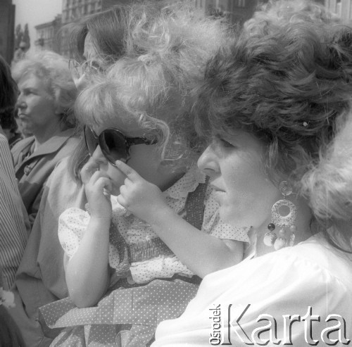 Czerwiec - sierpień 1991, Polska.
Czwarta pielgrzymka Ojca Świętego Jana Pawła II do Polski. Uczestnicy mszy świętej.
Fot. Jerzy Szot, zbiory Ośrodka KARTA