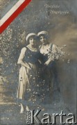 Pocz. XX wieku, Niemcy.
Portret dwóch kobiet w strojach ludowych, trzymających w ręce zielone gałązki i białe kwiaty. Podpis w języku niemieckim: 